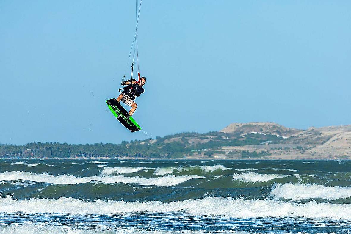 Advanced kitesurfer jumping the waves in Zanzibar